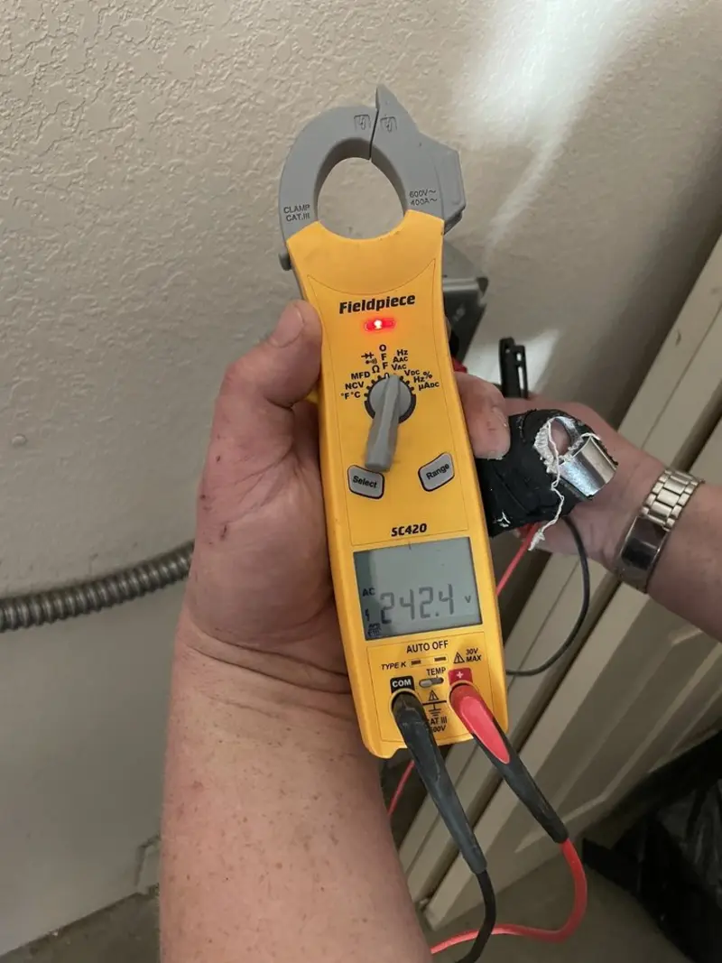 Voltage testing with clamp meter during Recessed Lighting Installation in Shawangunk
